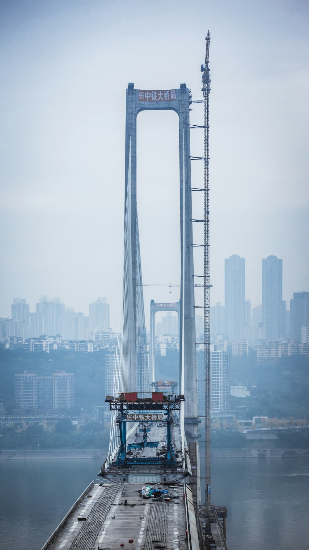 a large bridge with a crane on top of it