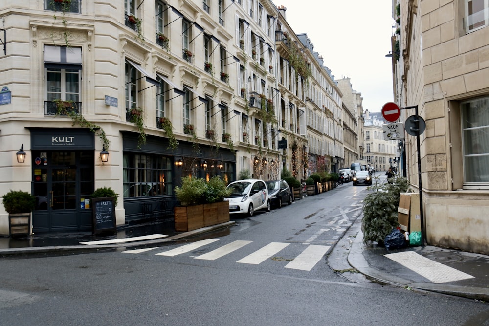 a street with cars parked on both sides of it