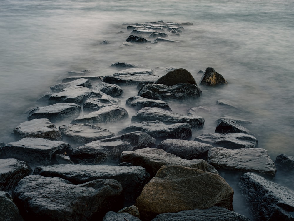 a long exposure of rocks in the water