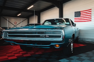a blue car is parked in a garage
