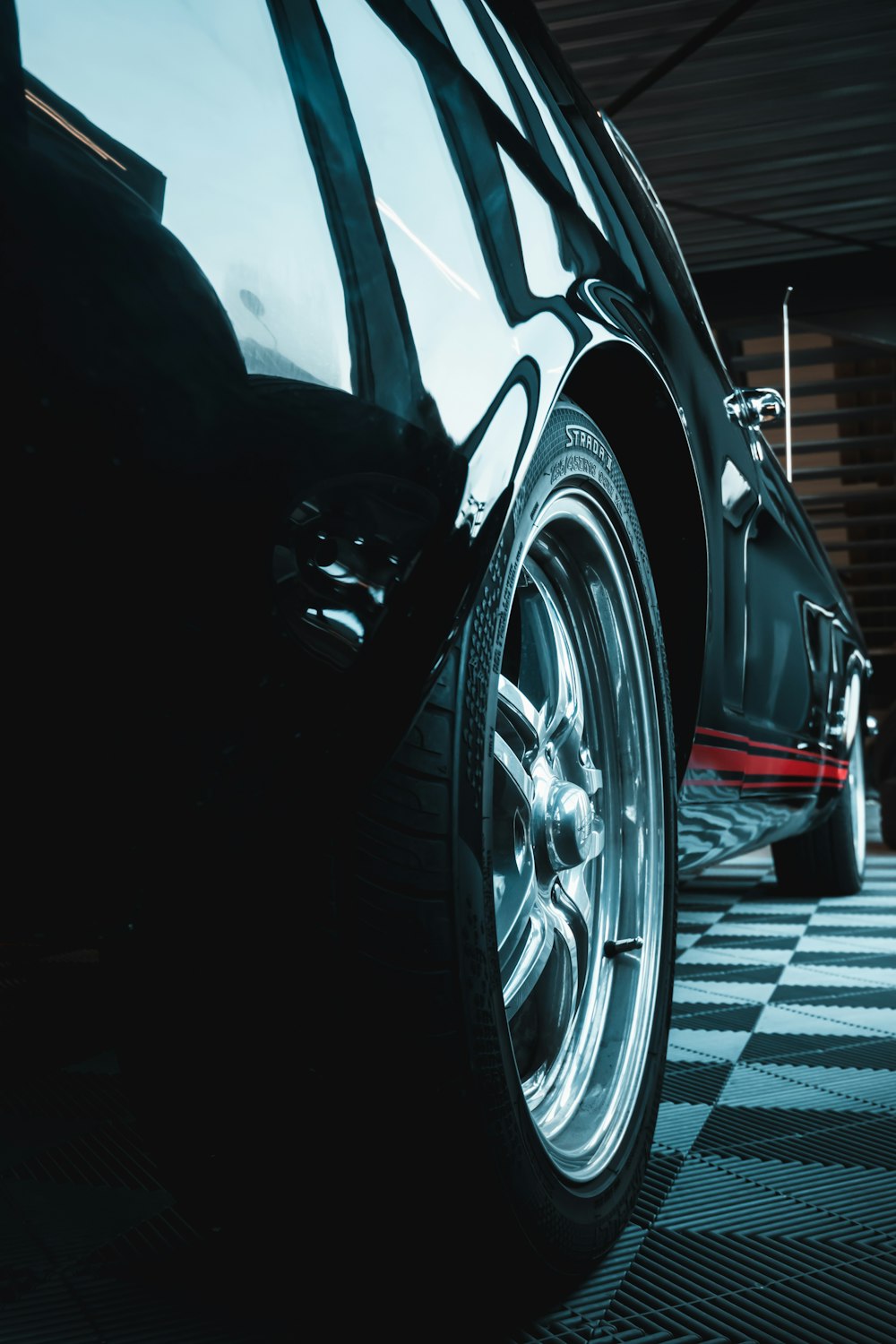 a close up of a car on a checkered floor