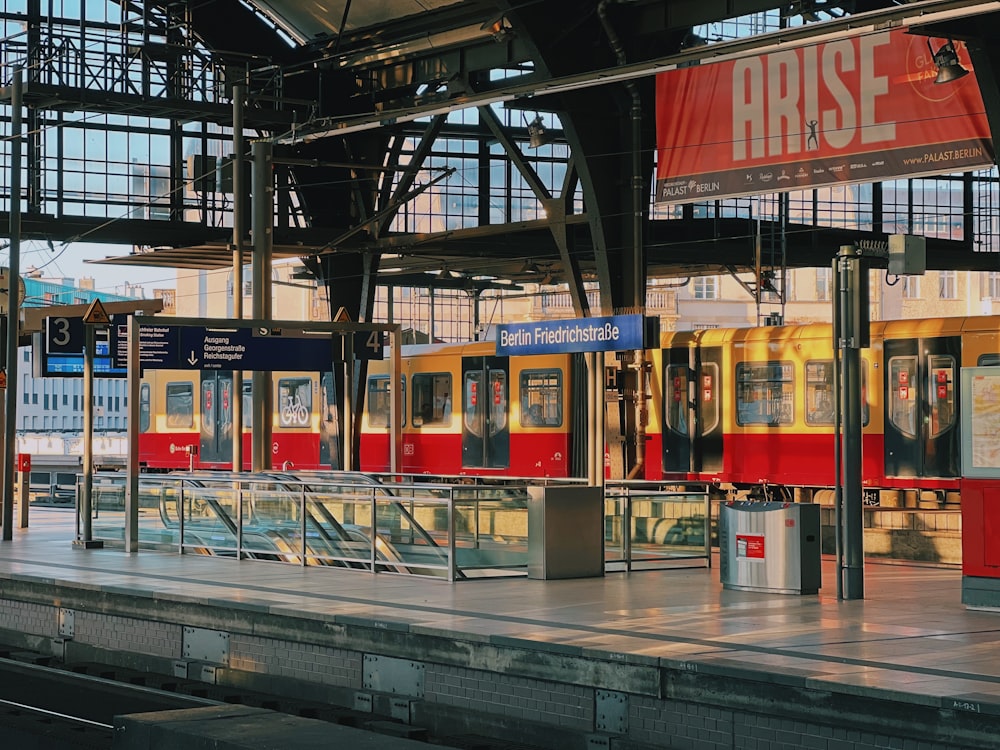 a train station with a train on the tracks