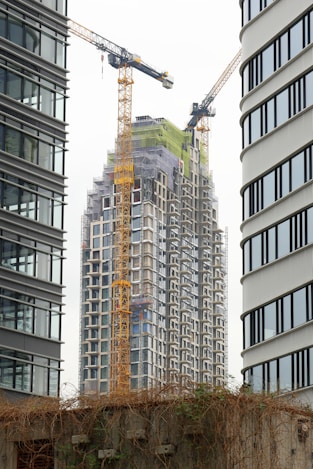 a couple of tall buildings sitting next to each other