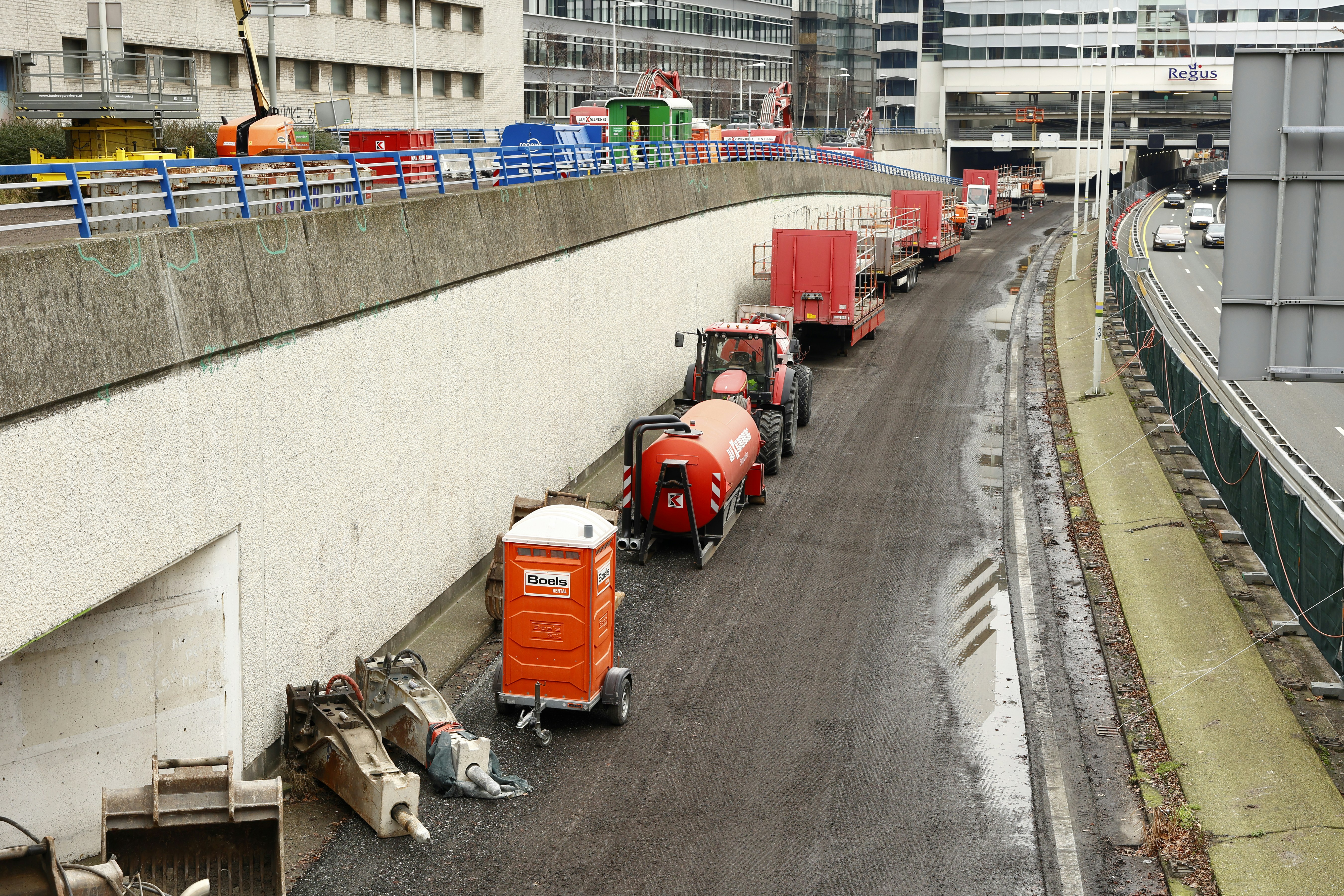 a line of trucks parked on the side of a road