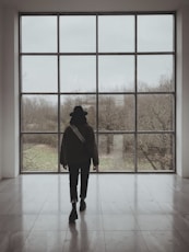 a person standing in front of a large window