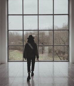 a person standing in front of a large window