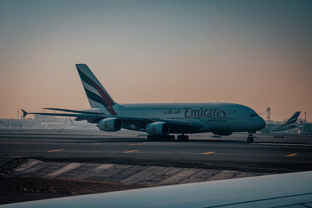 a large jetliner sitting on top of an airport tarmac