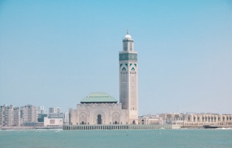 a large white building with a green roof