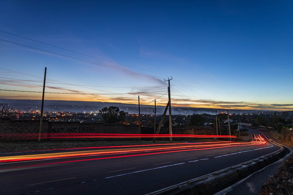 a long exposure shot of a highway at night