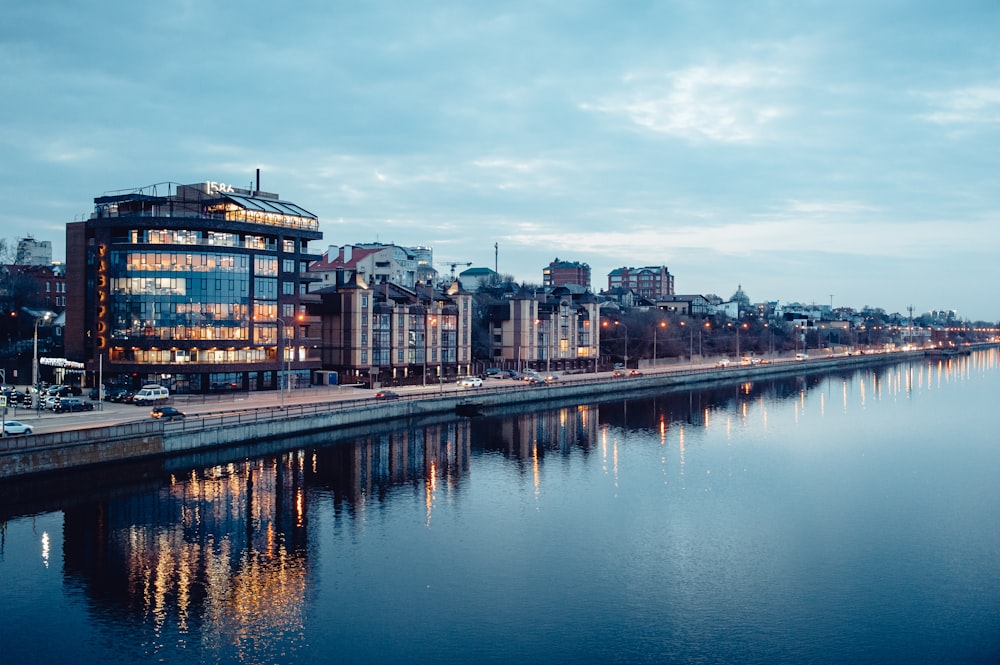 a body of water with a city in the background