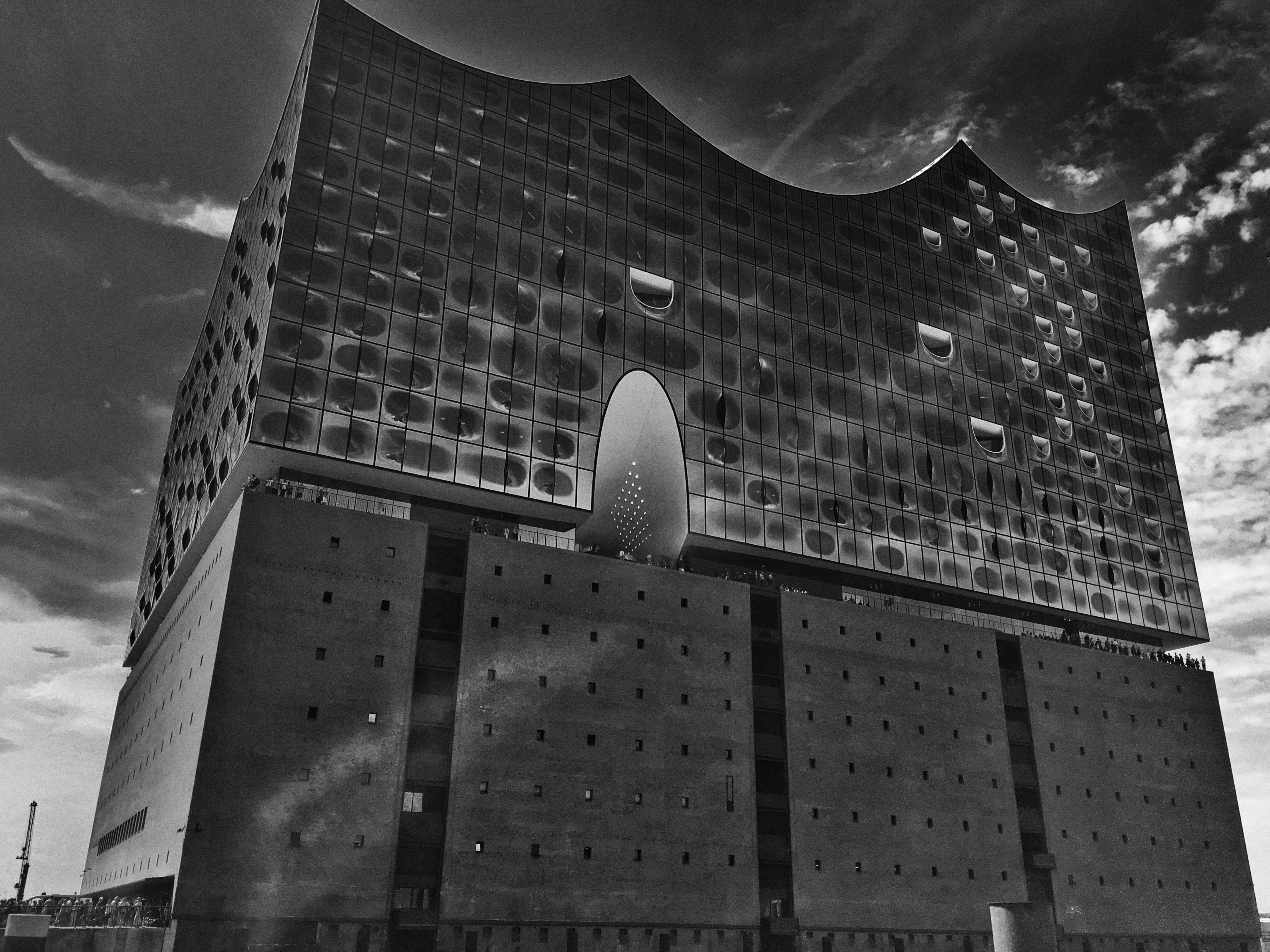 A tall building with a giant clock on the side of it photo Free