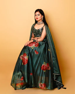 Stylish anarkali gown blending classic flare with a modern gown silhouette in deep jewel tones.
