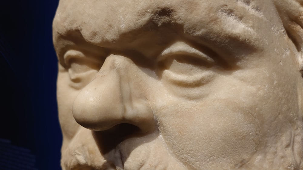 a close up of a statue of a man's face