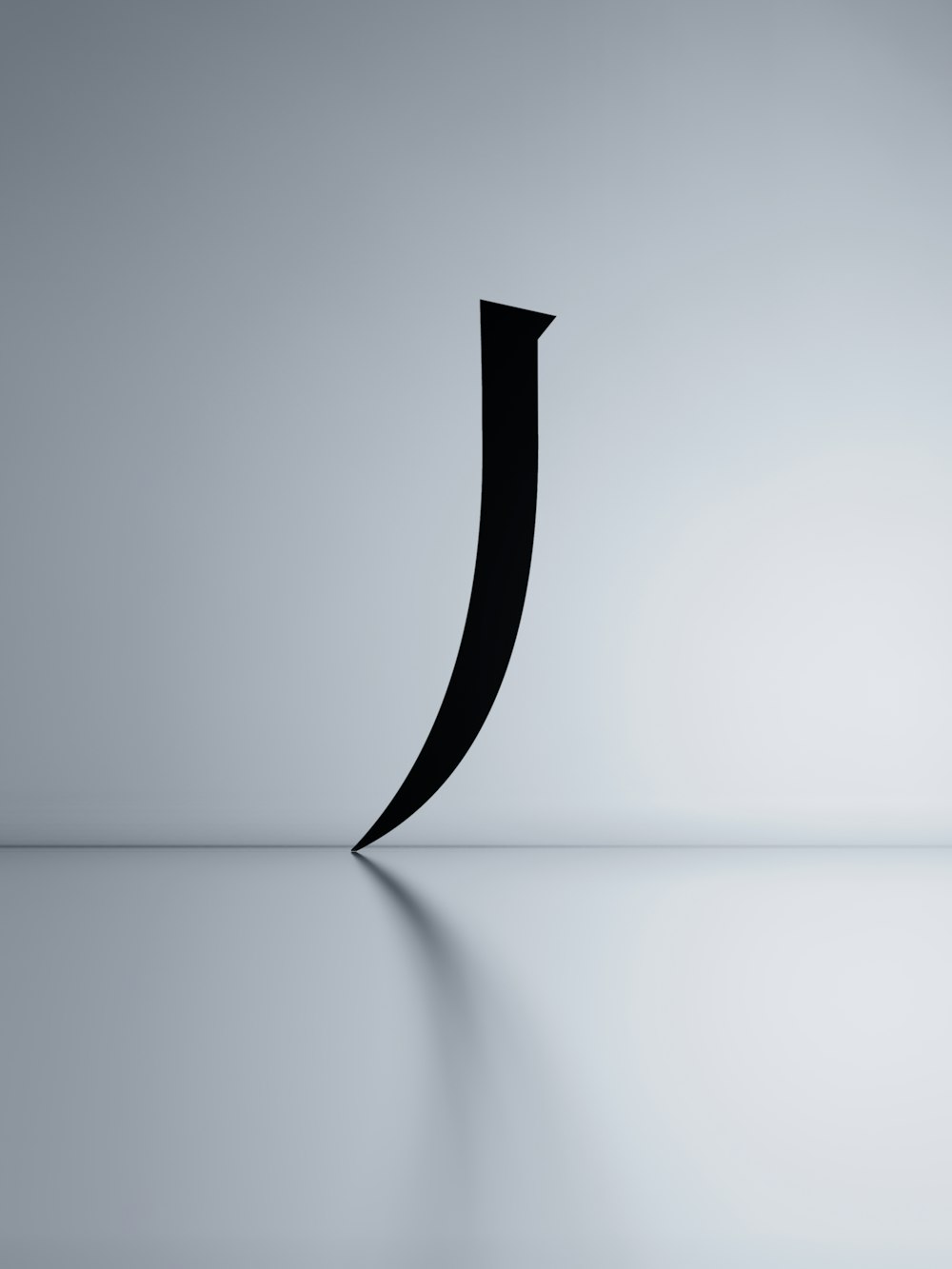 a black curved object sitting on top of a table