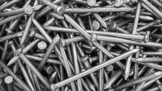 a pile of screws that are laying on top of each other