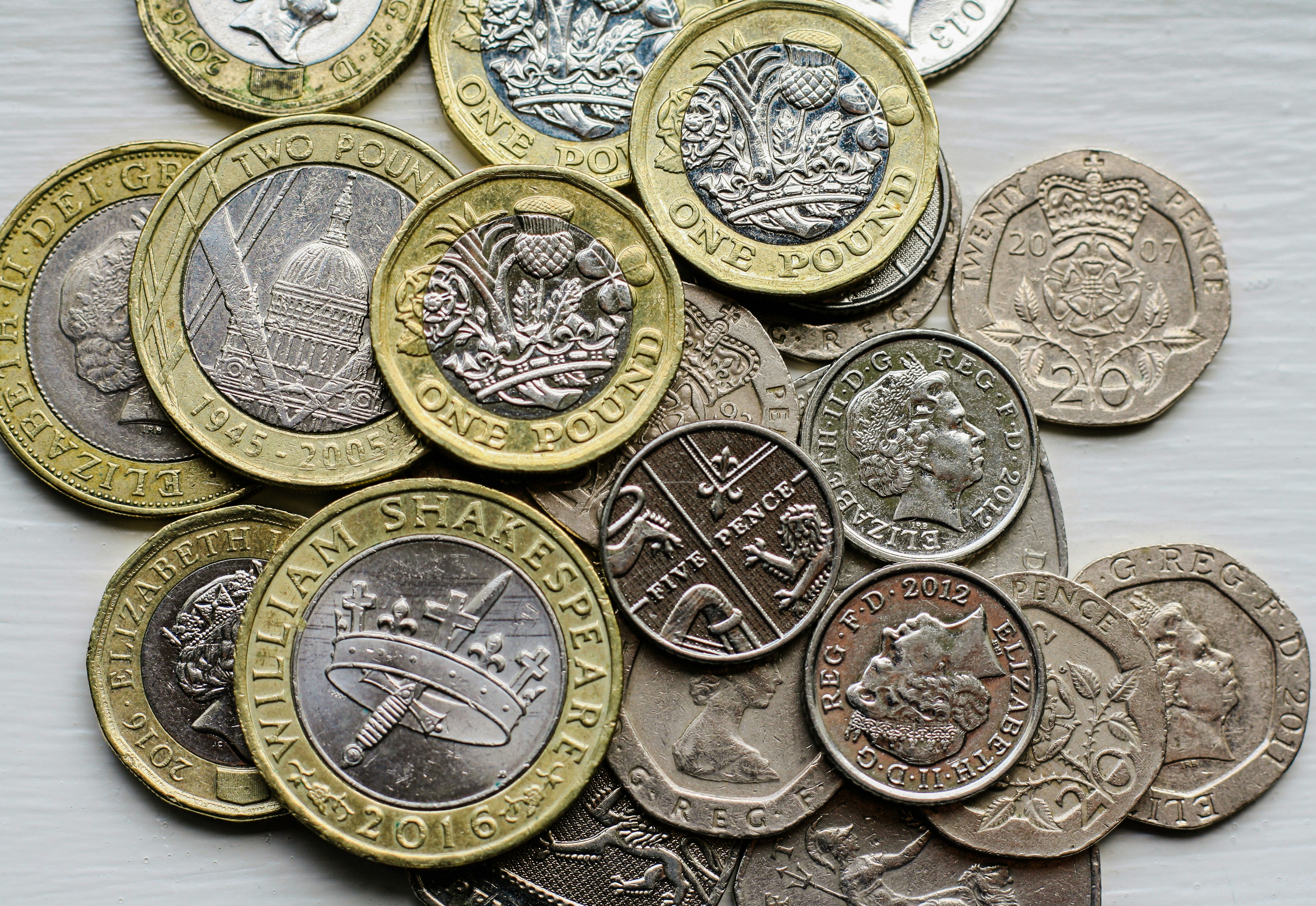 Make payments with UK Sterling, one pound coins, five pence pieces, twenty pence pieces.