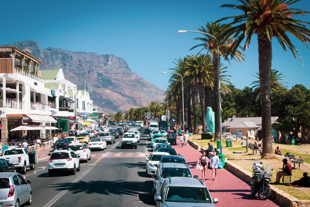 a city street with cars parked on both sides of the street