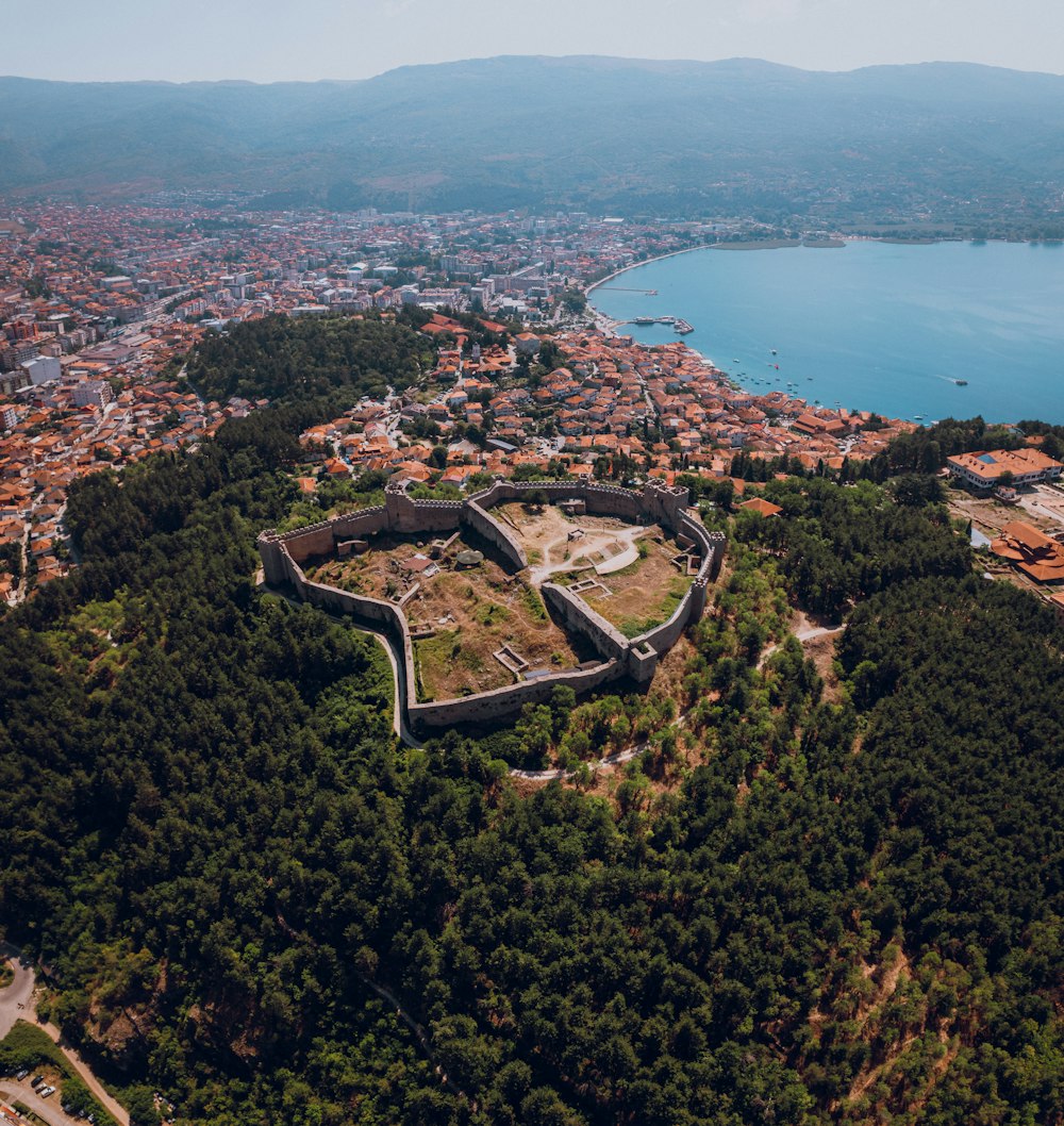 an aerial view of a city and a body of water