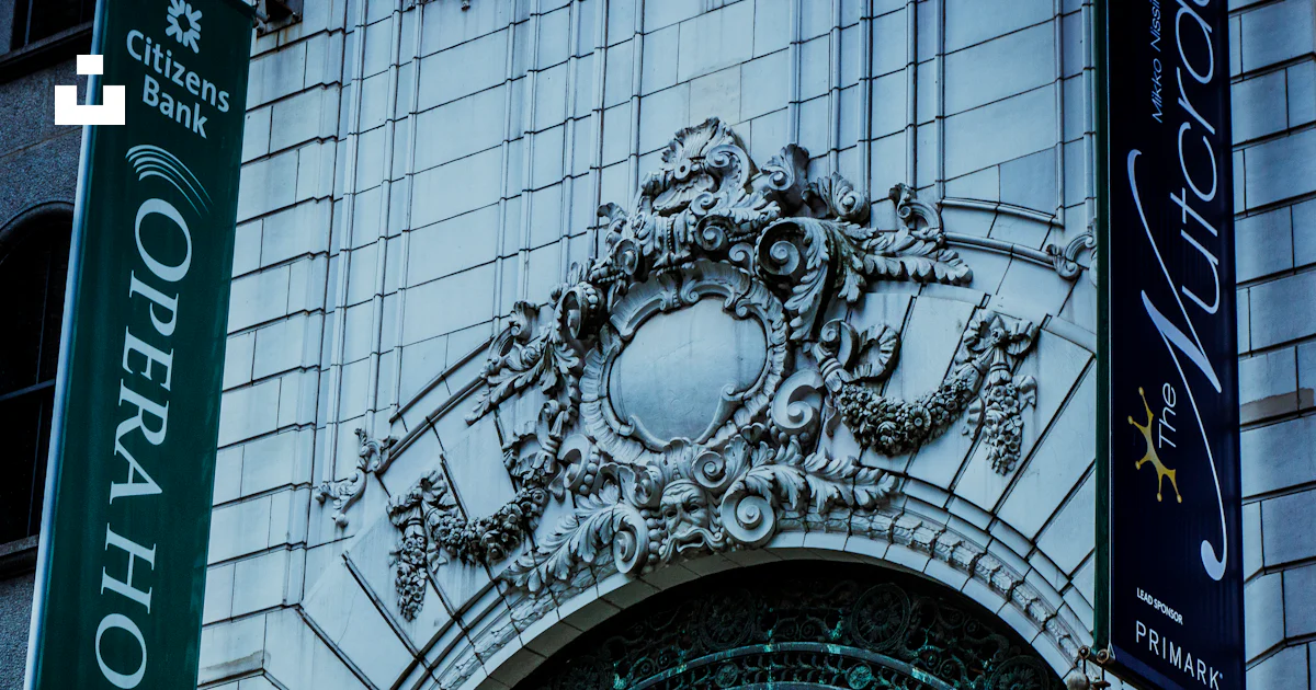 Opera Buildings Sign A building with a sign for opera house photo – Free City Image on Unsplash