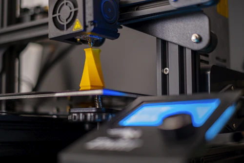 Close-up of a 3D printer producing a precision-printed component