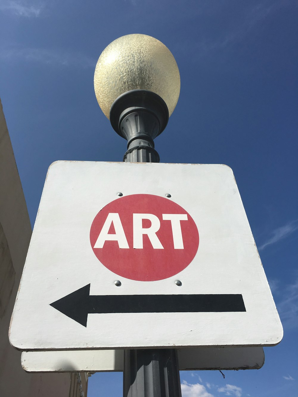 a street sign with an arrow pointing to the right