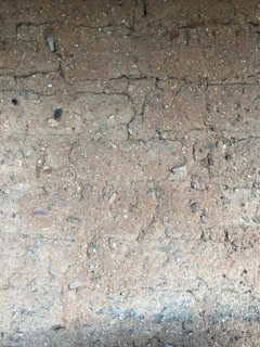 Close-up of a maintenance-free earthing rod securely installed in rocky soil
