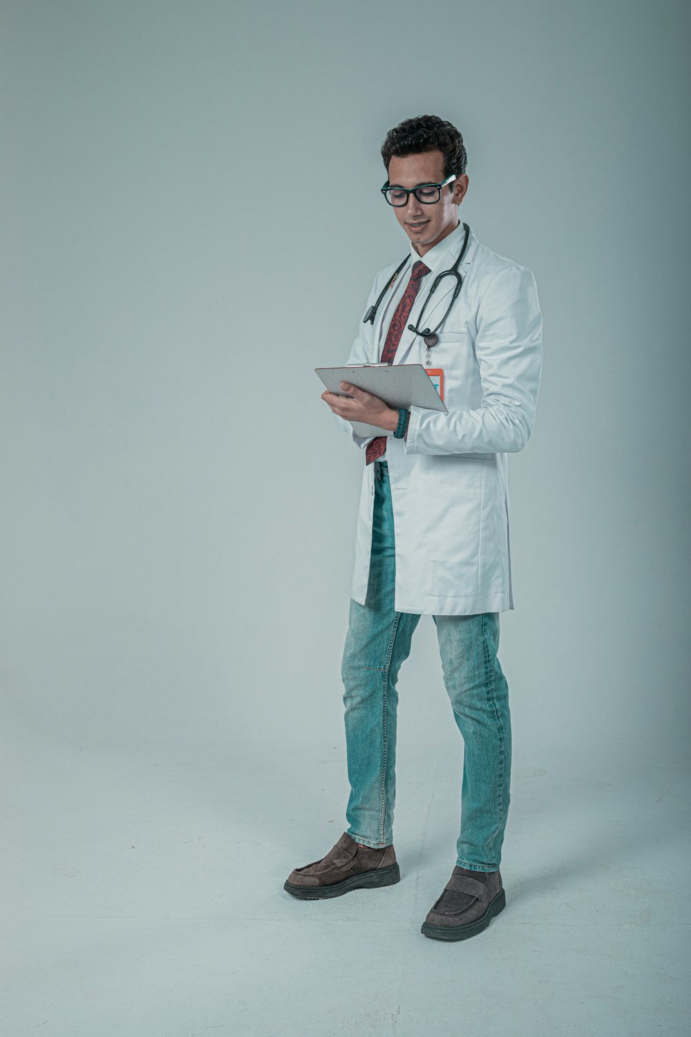 a male doctor in a white coat and tie