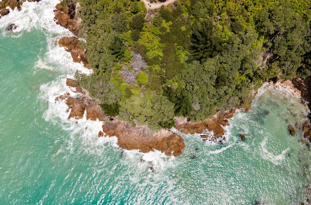 an aerial view of the ocean and land