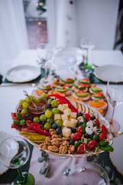 a platter of fruit and nuts on a table
