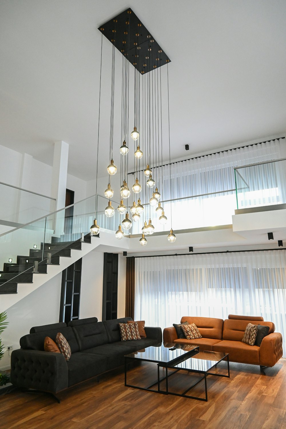 a living room filled with furniture and a chandelier