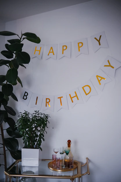 a happy birthday banner hanging on a wall