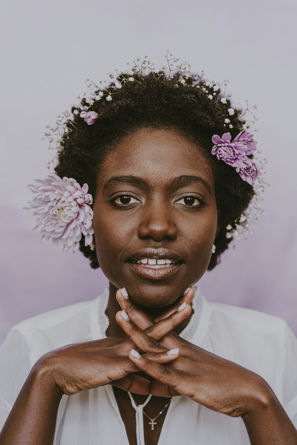 a woman with a flower in her hair