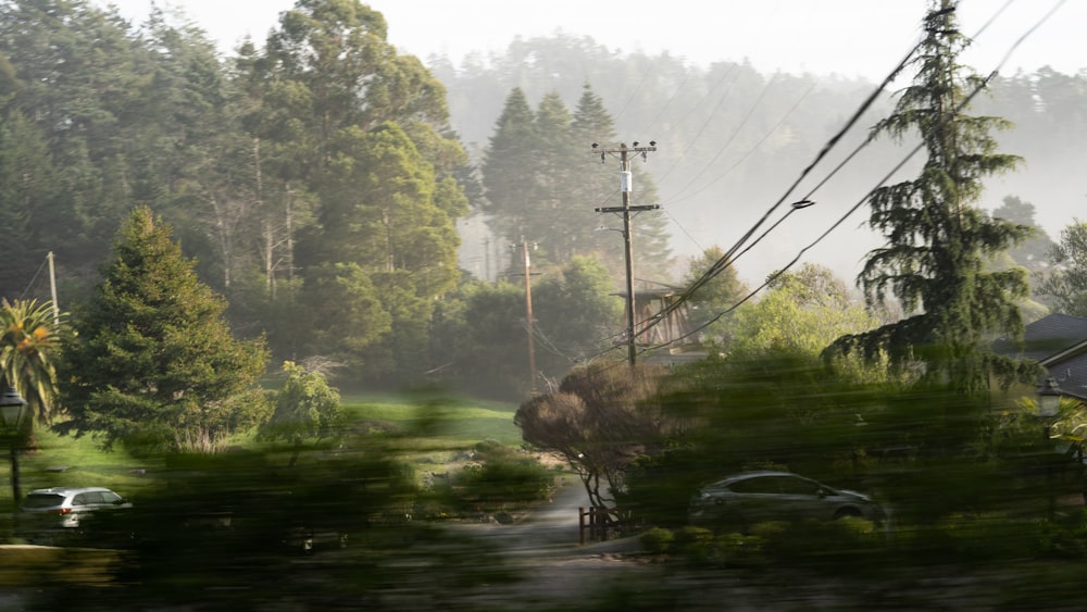 a blurry picture of a street and trees