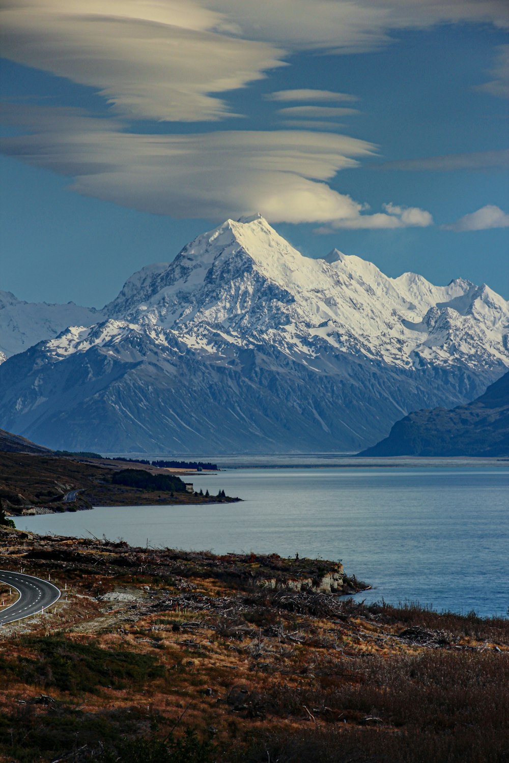 a large mountain with snow on top of it