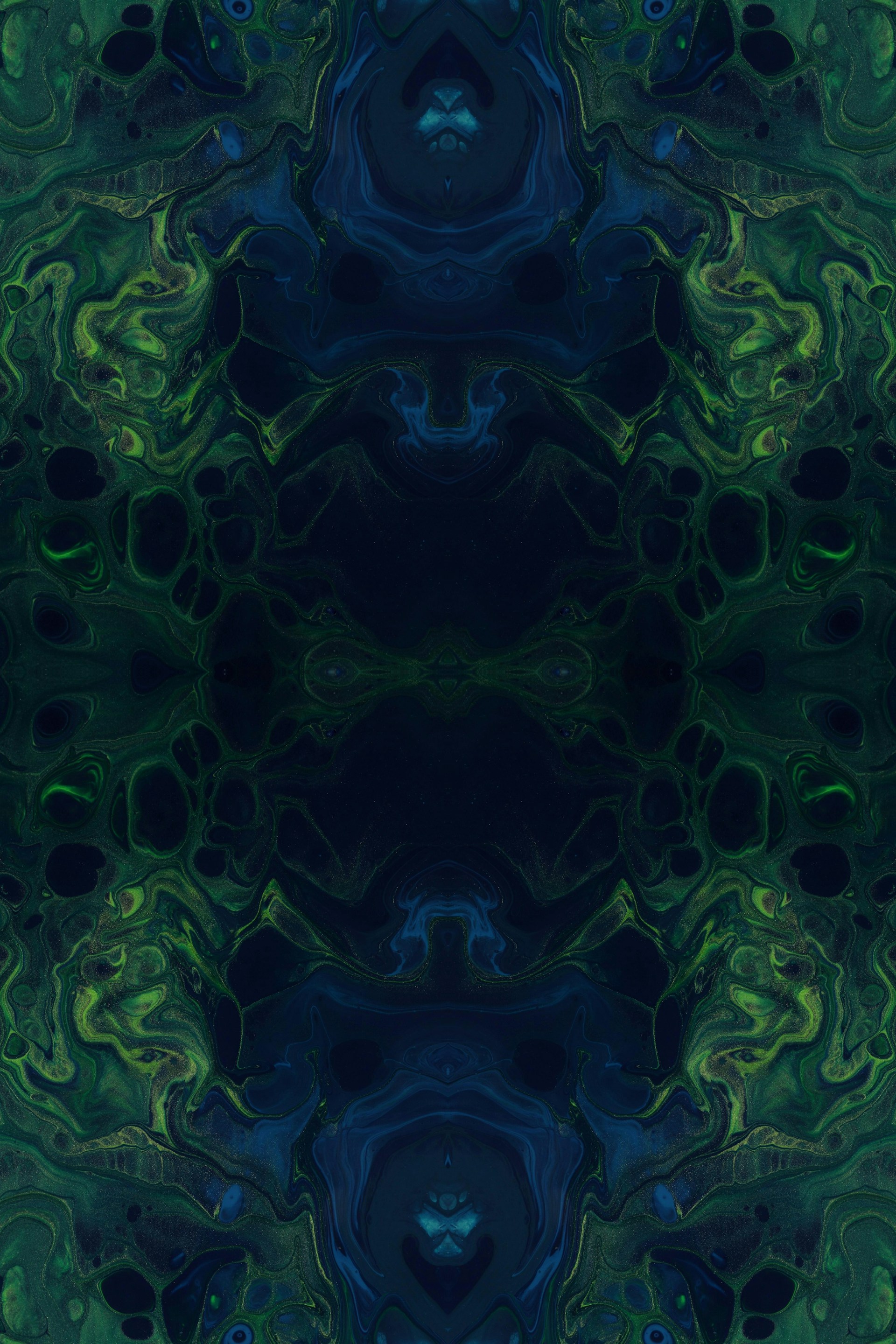a blue and green abstract background with a black center