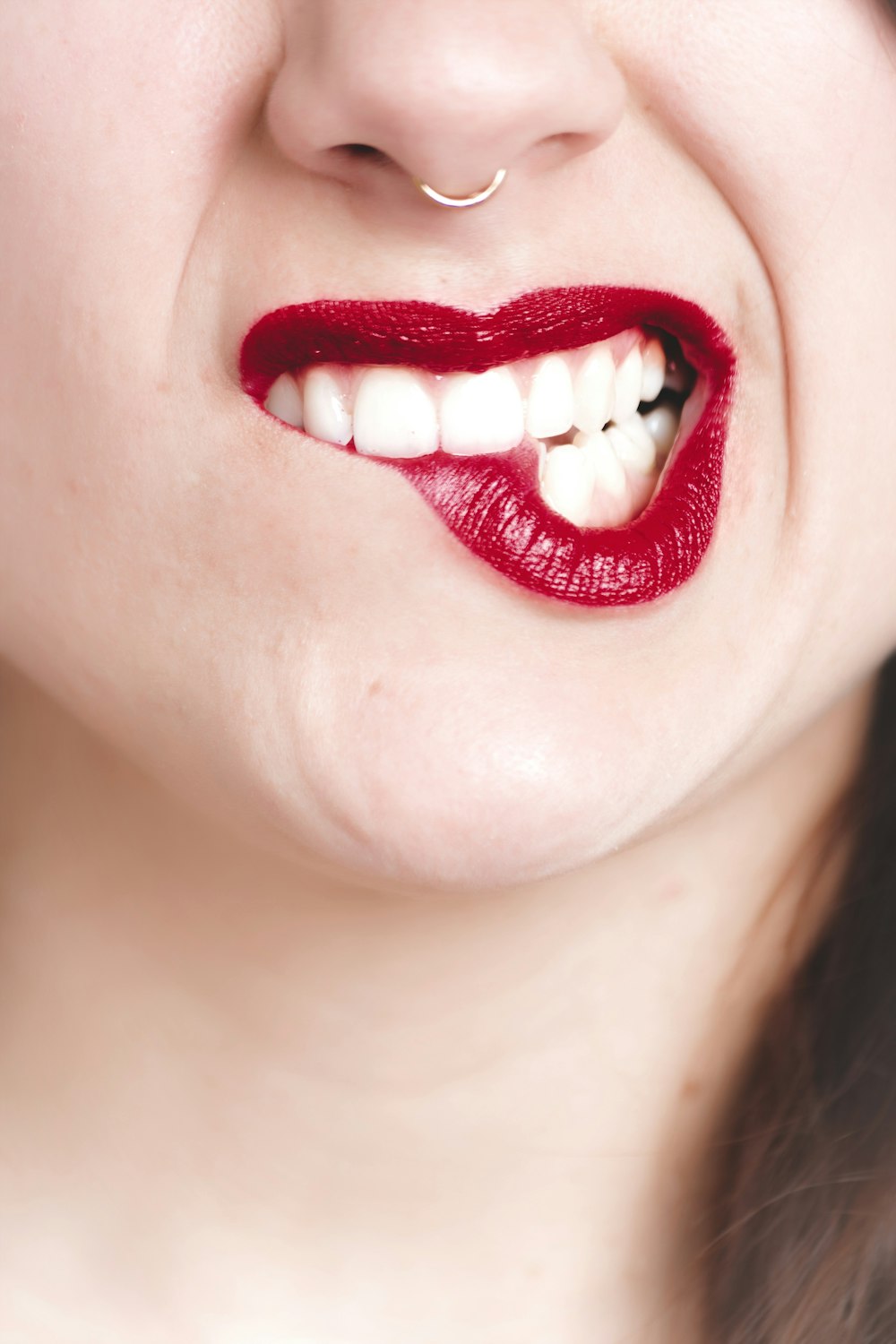 a close up of a person with red lipstick