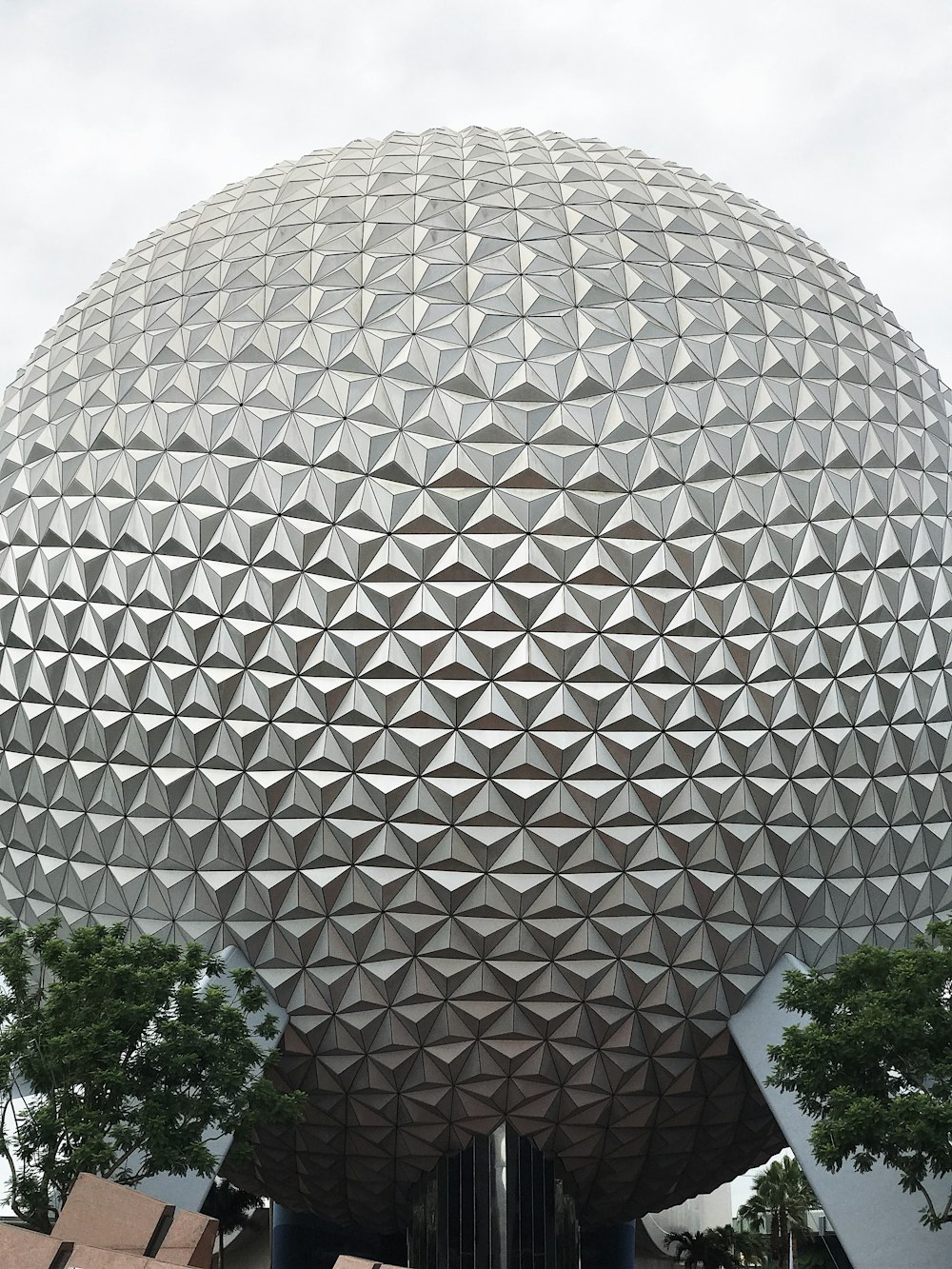 a large building that has a very large ball on top of it