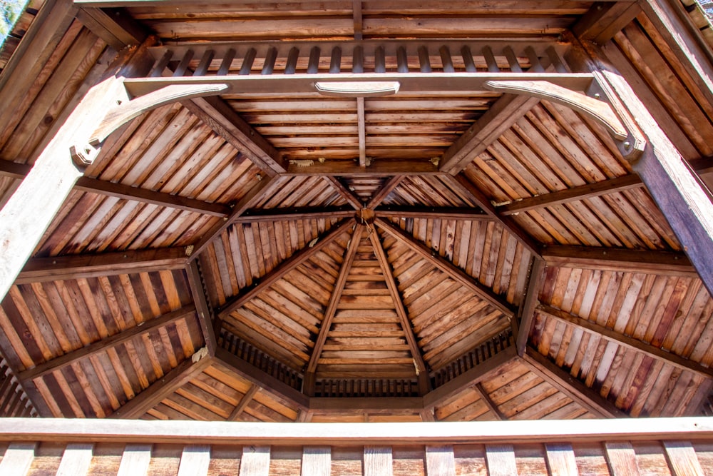 a wooden structure with a roof made of wood planks