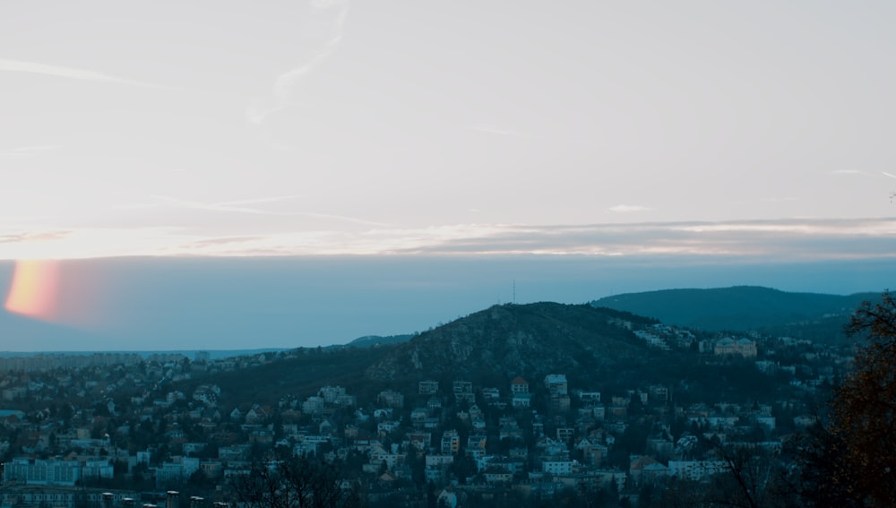 a view of a city from a hill