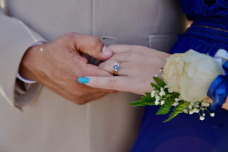 a close up of a person holding a person's hand