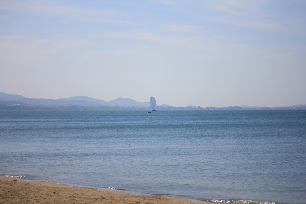 a body of water with a boat in the distance