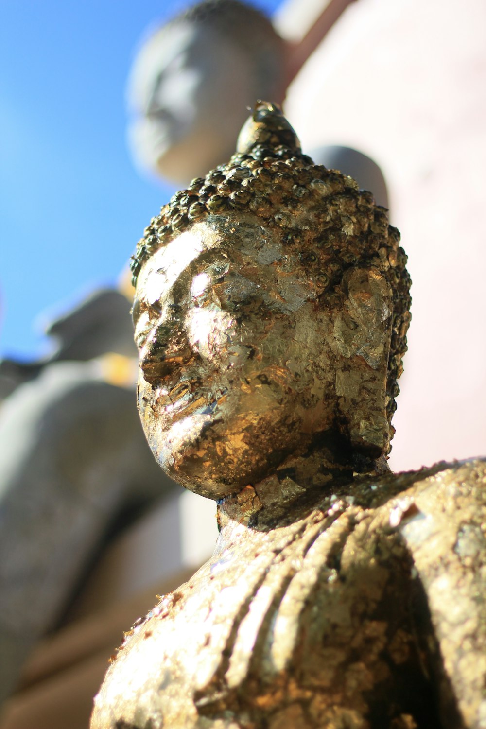 a close up of a statue of a buddha