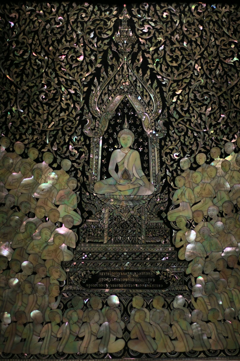a picture of a buddha statue in the middle of a room