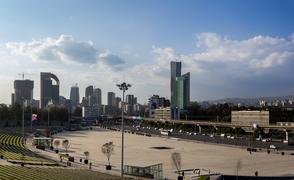 a large empty stadium with a city in the background