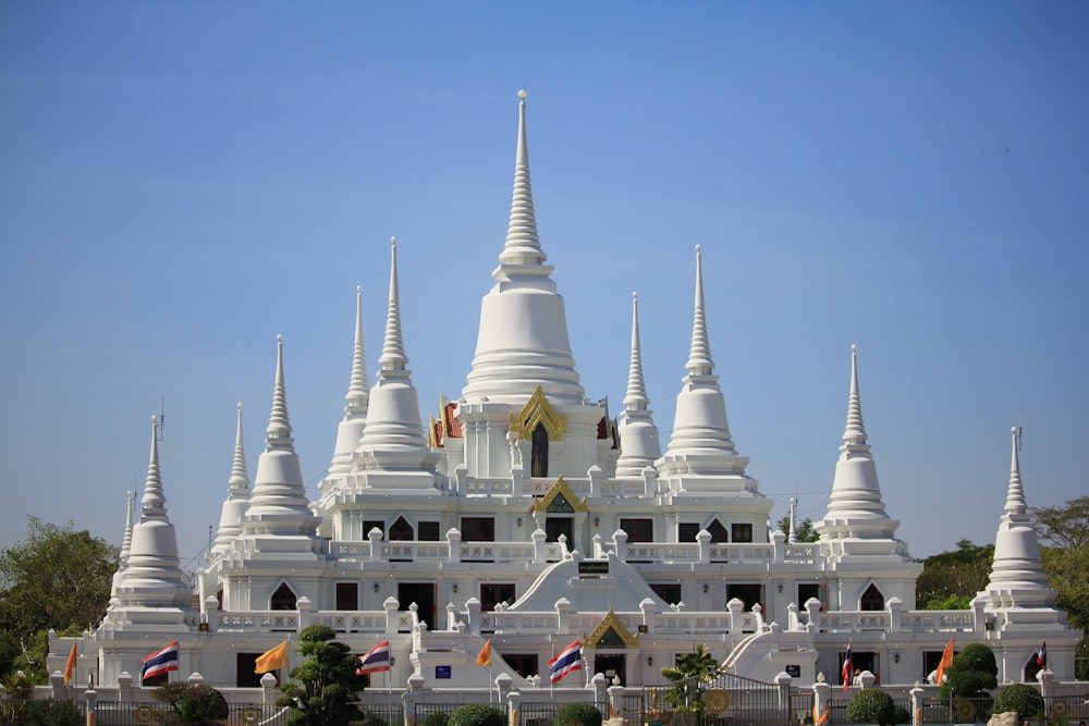a large white building with many spires on top of it