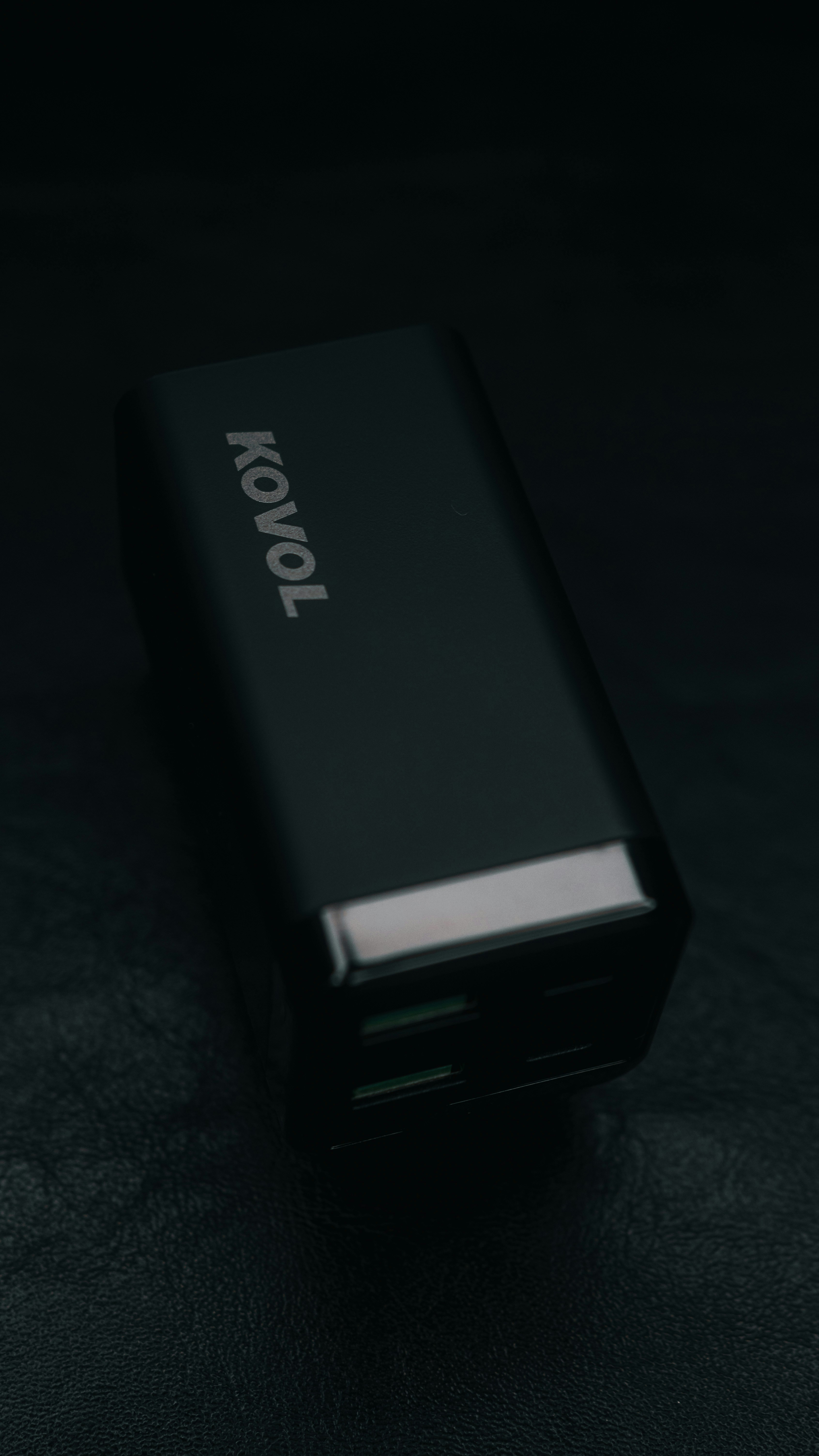 a close up of a cell phone on a black surface