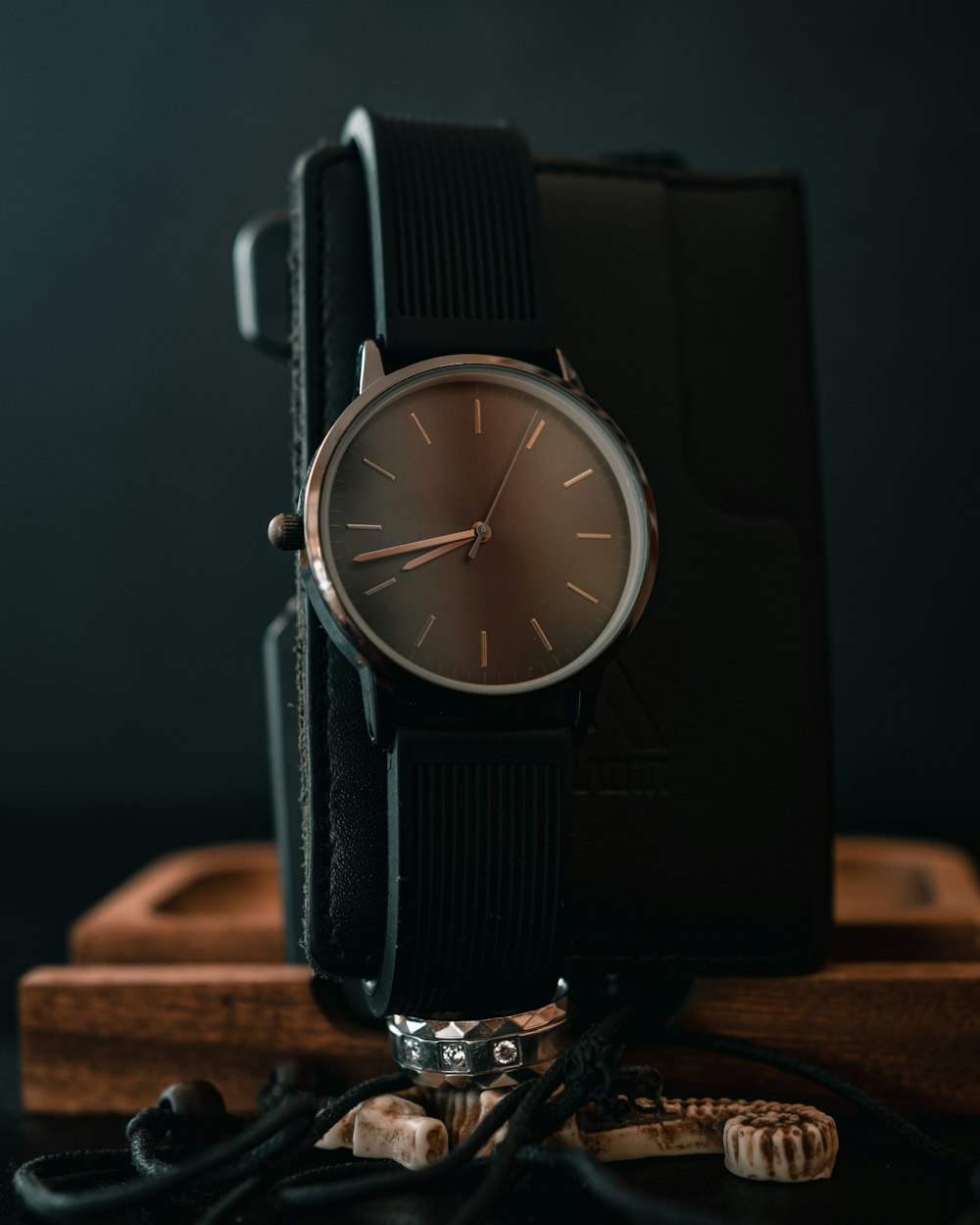 a watch sitting on top of a wooden box