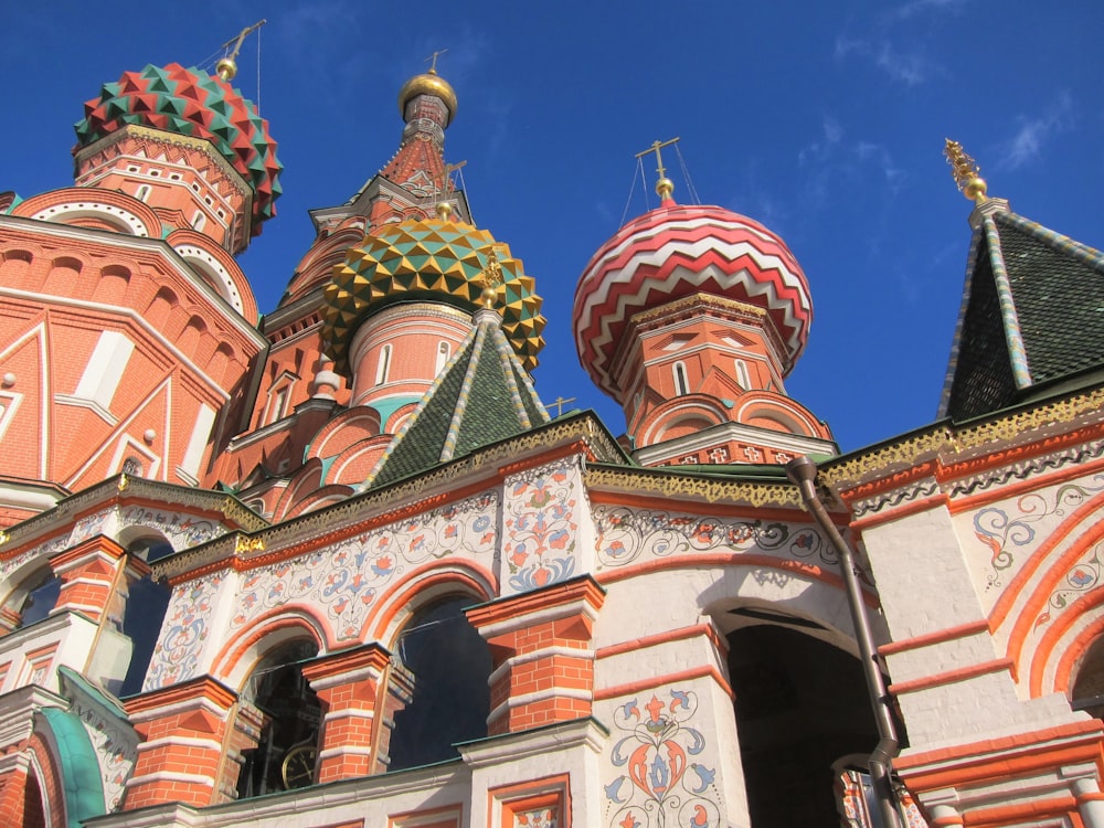 a large building with two towers and a sky background