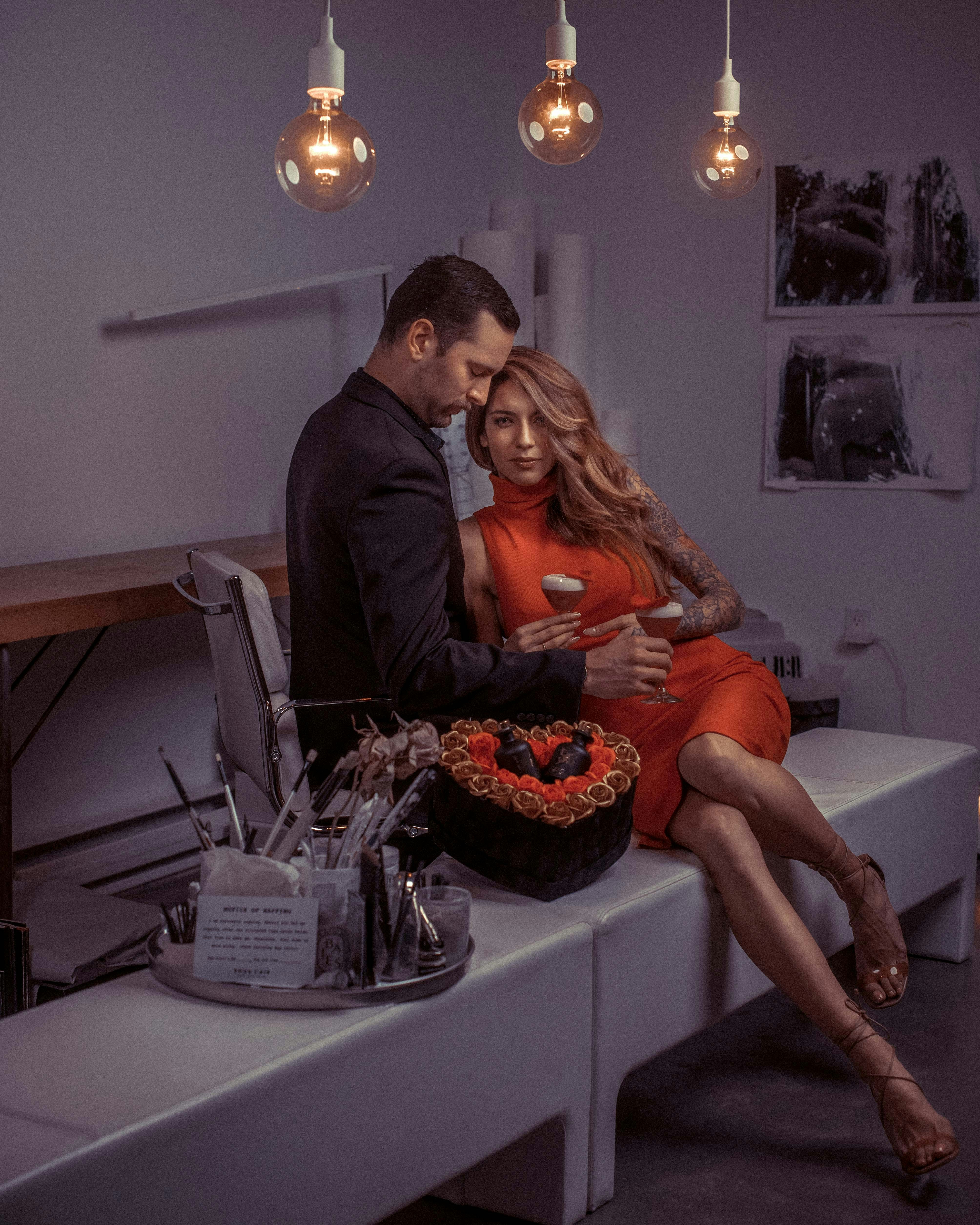 a man and a woman sitting on a table