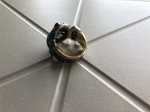 Bronze ring featuring a textured surface reminiscent of antique textiles.